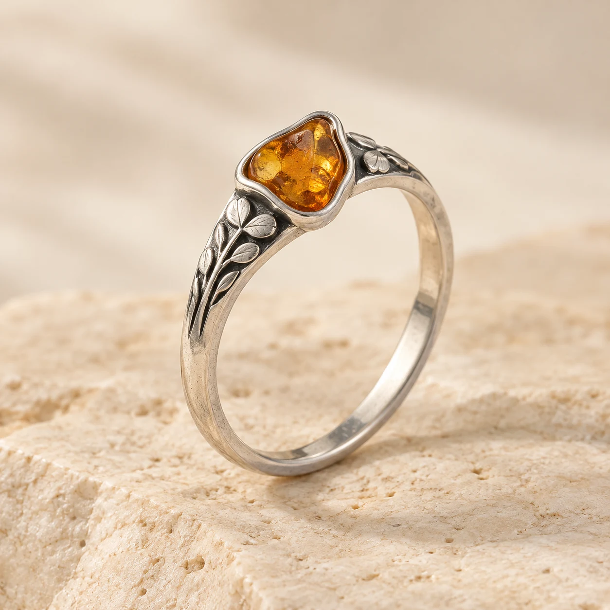 Clover Trace: honey irregular amber ring with three-leaf clover